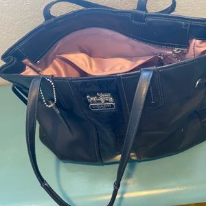 Versatile and stylish black leather Coach bag